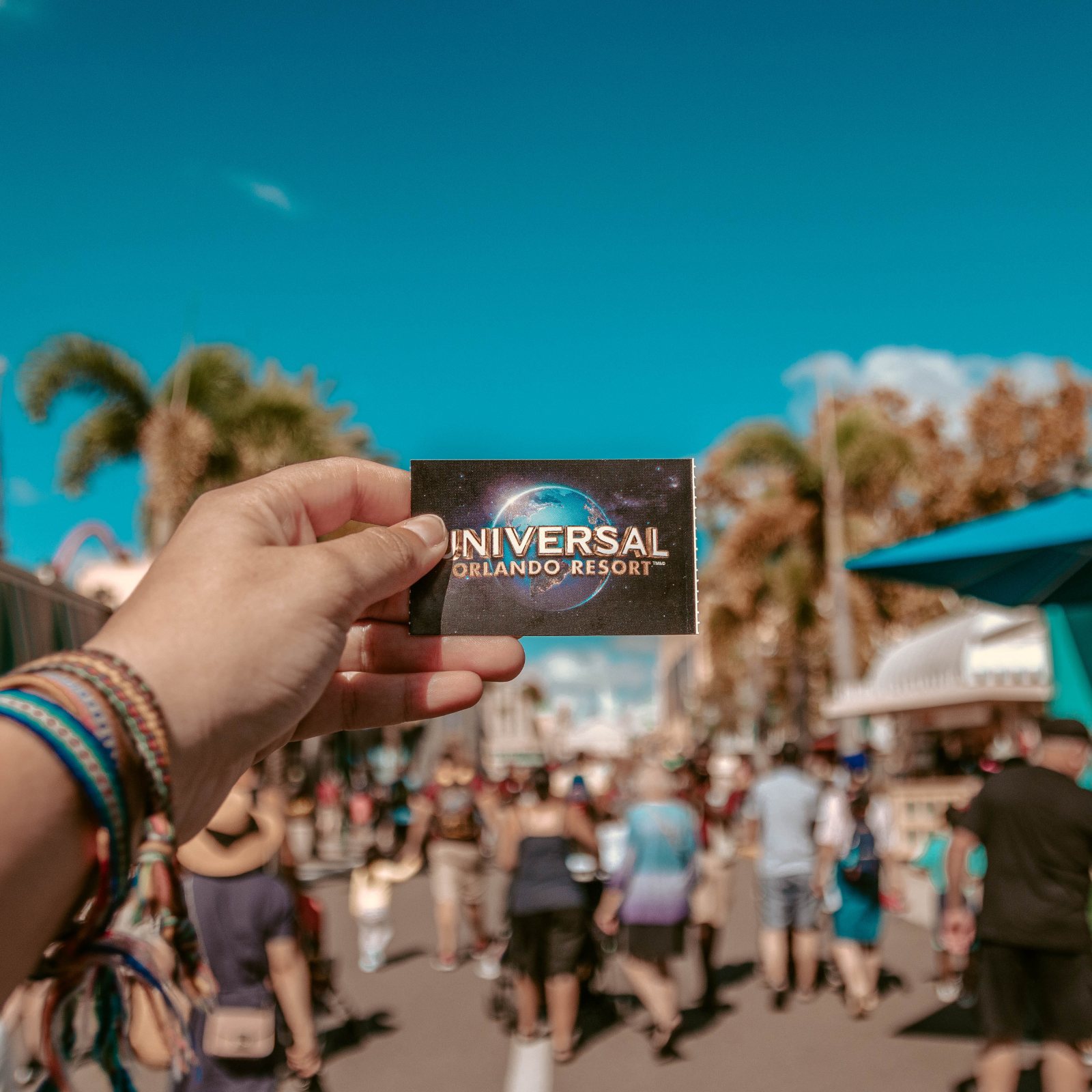 Person Holding Universal Orlando Resort Ticket